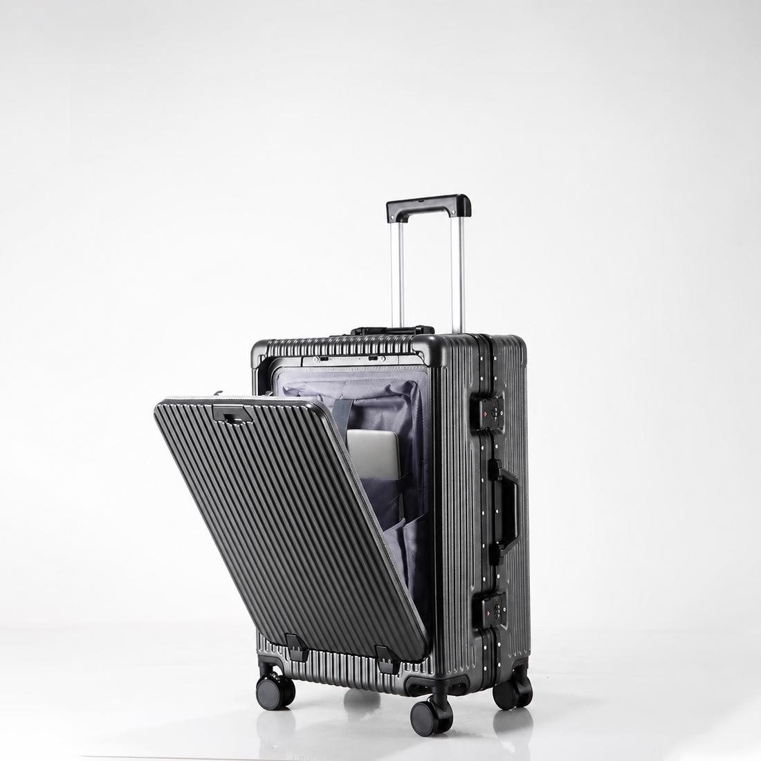 Black suitcase with an open front compartment, extended telescopic handle and four wheels.